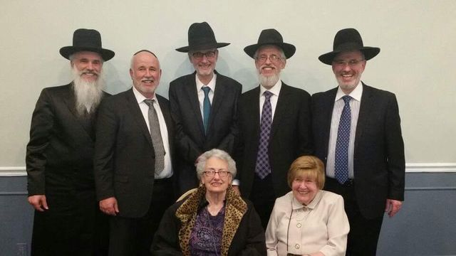 The five brothers standing; seated in front, YoungMa on the right and her sister Bettye on the left.