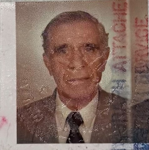 Passport photo of YoungPa in a suit and tie
